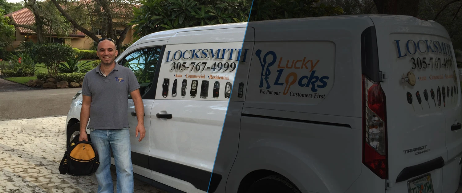 A locksmith technician is standing next to a work van and holding a tool bag in his hand